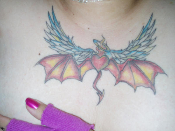 torn in two - chest tattoo