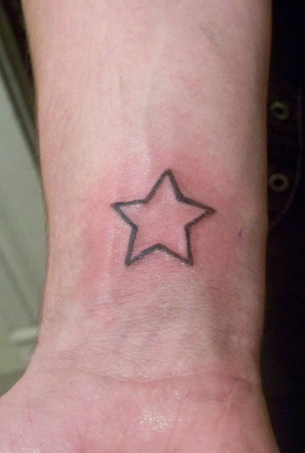 star tattoo on elbow. star tattoo on elbow