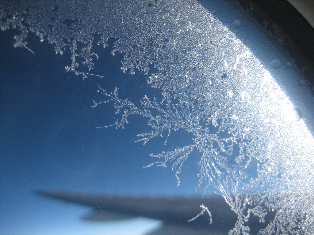 ice_on_aeroplane_window_by_rottenappletowers.jpg
