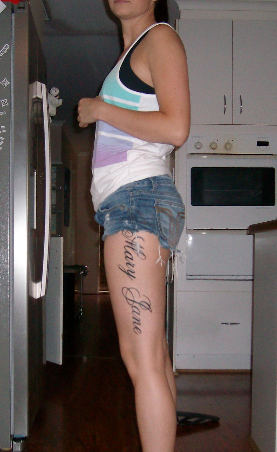 The Girl With Leg tattoos 23